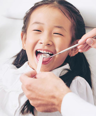 young girl relieved of her tooth pain after an emergency dental visit to Bishop Arts Kids Pediatric Dentistry