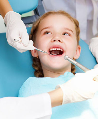 pediatric patient getting her teeth cleaned at Bishop Arts Kids Pediatric Dentistry in Dallas, TX